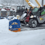 Manitou telehandler plowing snow with KAGE SnowFire