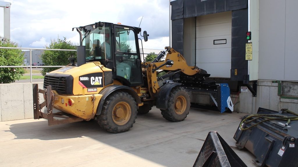Back Drag Kit on Wheel Loader Snow Pusher in Loading Dock