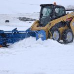 KAGE SnowFire Plow and Pushers on CAT Skid Steers
