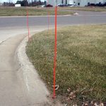 Snow Stakes Installed Against Curb