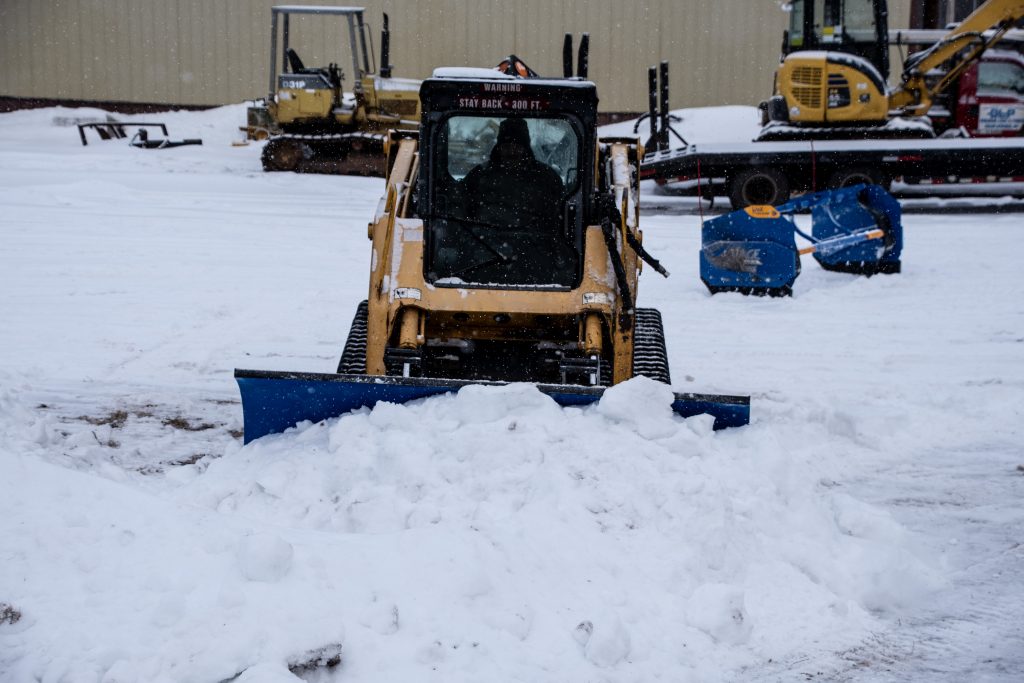 SnowFire Xtreme Snow Blade plowing with Box in Background